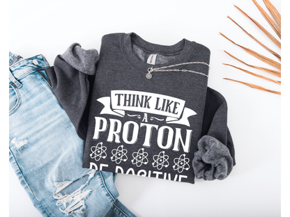 Think Like A Proton Be Positive Crewneck